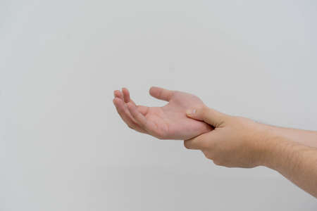 close up senior man massage on palm to relief pain from hard working for treatment about gout and...