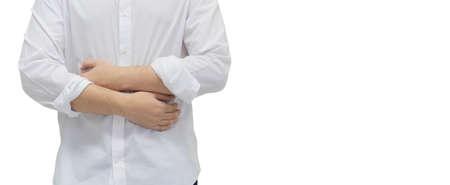 close up adult man hand massage on stomach after got pain feeling isolated on white background fro...