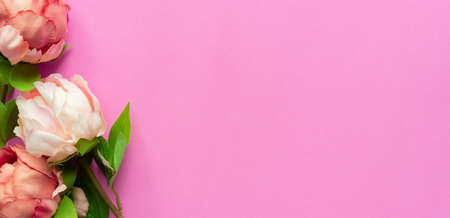 Flowers composition. Frame made of pink peony flowers on pink background. Flat lay, top view, copy spaceの写真素材