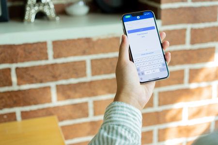 Woman hand holding iPhone X with Instagram application on the screen.