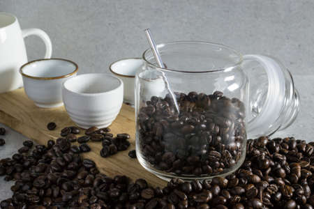 Jar of coffee bean on the stone table.の写真素材