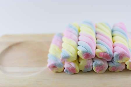 Colorful candy on wood board.の写真素材