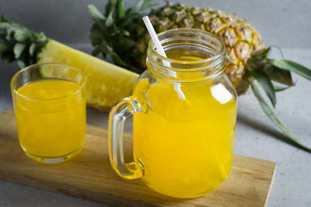Pineapple juice in a jar on stone table.の写真素材