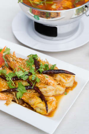 Fried shrimp with tamarind sauce in white dish on table.の写真素材