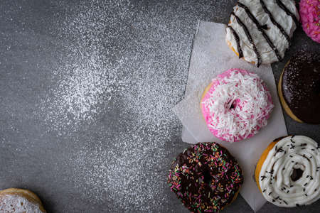Donut with chocolate glazed and strawberry glazed on concrete table.の写真素材