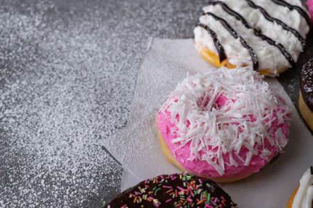 Donut with chocolate glazed and strawberry glazed on concrete table.の写真素材