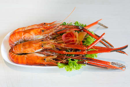 Grilled shrimp,Burn shrimp in white plate on the stone table.の写真素材