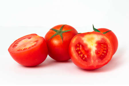 Group of haft tomatoes sliced on white background.の写真素材