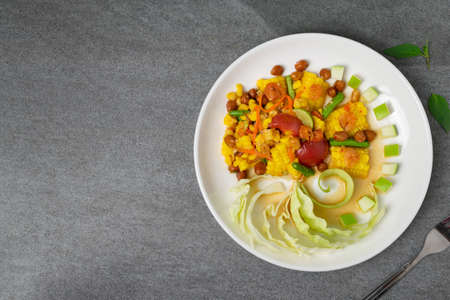 Fruit spicy salad in white dish on concrete table.の写真素材