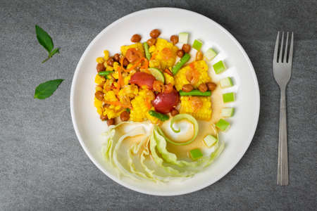 Fruit spicy salad in white dish on concrete table.の写真素材