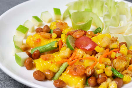 Fruit spicy salad in white dish on concrete table.の写真素材