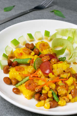 Fruit spicy salad in white dish on concrete table.の写真素材