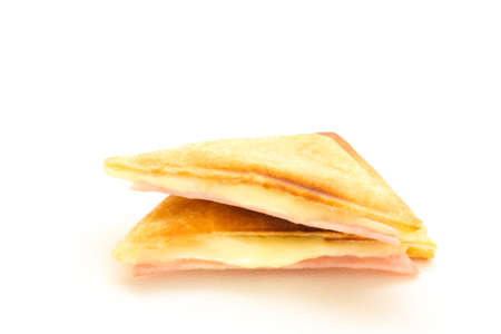 Croissant stuffed with ham and cheese isolated on white background.の写真素材