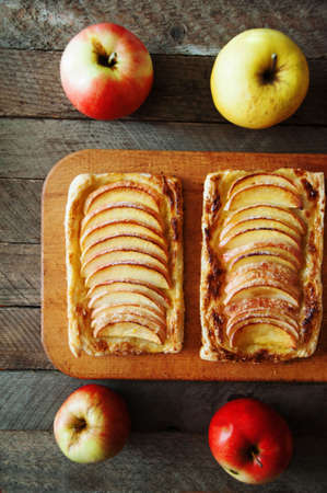 Delicious apple puff on a wooden tableの写真素材