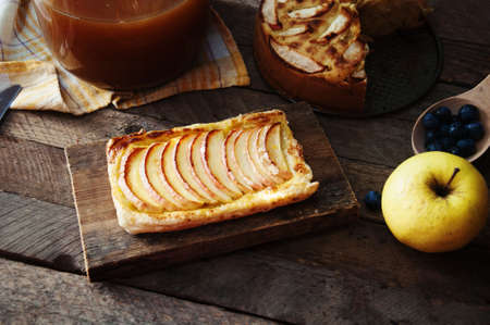 Delicious apple puff on a wooden tableの写真素材