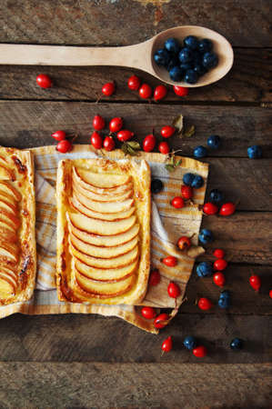 Delicious apple puff on a wooden tableの写真素材