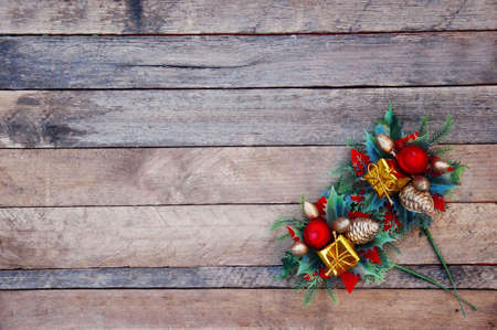 Christmas decoration, green pine branches on wooden background.の写真素材