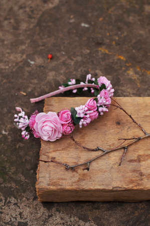 Handmade flowers wreath on outdoor metal stand.の写真素材