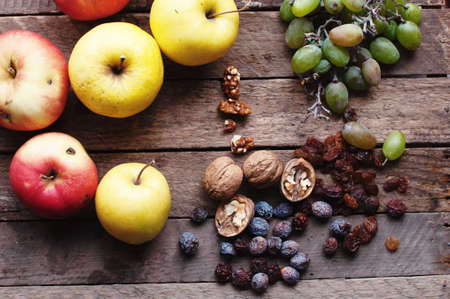 Assortment of fruits on wood backgroundの写真素材