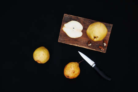 Ripe fresh organic pears on black backgroundの写真素材