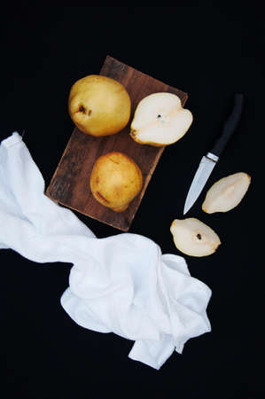 Ripe fresh organic pears on black backgroundの写真素材