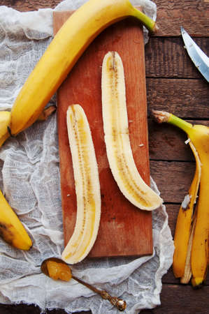 bananas on a metal tray. rustic food. fruit. metal backgroundの写真素材