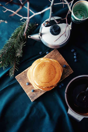 Sweet fresh poppy seed pancakes with chocolate fondant and decorated with fresh raspberries on a...