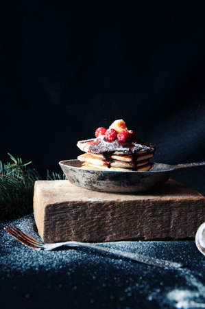 sweet fresh poppy seed cupcakes with chocolate fondant and decorated with fresh raspberries on a...