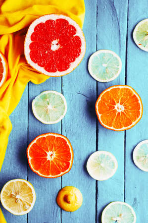 Fruit in a cut closeup, grapefruit, orange, lemon, tangerine, fruit background.の写真素材