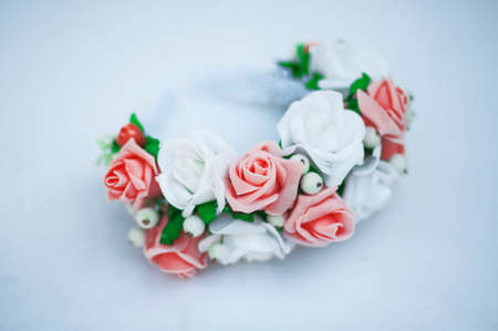 Hoop from flowers, wreath with colored flowers. Handmade flowers wreath on white. Accessory. Artificial flowers. Hair accessories. Beauty. Fashion. Decoration for the head. Wreath hairの写真素材