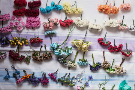 Hoop from flowers, wreath with colored flowers. Handmade flowers wreath on white. Accessory. Artificial flowers. Hair accessories. Beauty. Fashion. Decoration for the head. Wreath hair.の写真素材