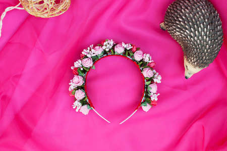 Hoop from flowers, wreath with colored flowers. Handmade flowers wreath on white. Accessory. Artificial flowers. Hair accessories. Beauty. Fashion. Decoration for the head. Wreath hair.の写真素材