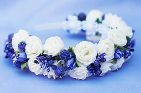 Hoop from flowers, wreath with colored flowers. Handmade flowers wreath on white. Accessory. Artificial flowers. Hair accessories. Beauty. Fashion. Decoration for the head. Wreath hair.の写真素材