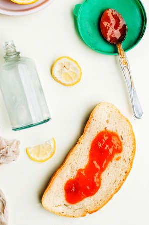 Homemade sandwiches with peach and cherry jam on a white background. It is decorated with fir branches. Butter and Jelly Sandwich. Flat lay.の写真素材