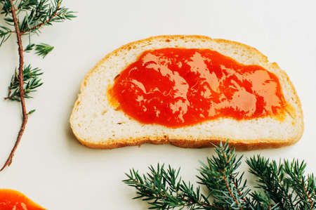 Homemade sandwiches with peach and cherry jam on a white background.の写真素材