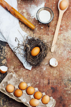 Baking cake ingredients - bowl, flour, eggs, egg whites foam, eggbeate on wood chalkboard from...