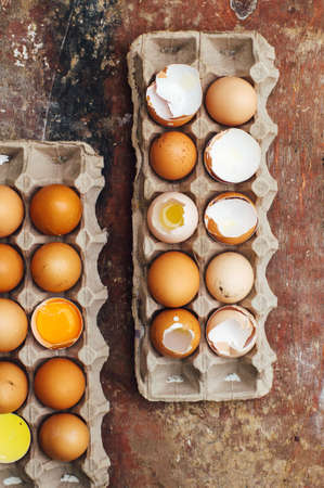 Baking cake ingredients - bowl, flour, eggs, egg whites foam, eggbeate on wood chalkboard from above.の写真素材