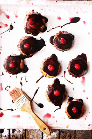 Homemade  cupcakes onto an wooden background. Rustic style. Homemade fresh pastries. Food background.の写真素材