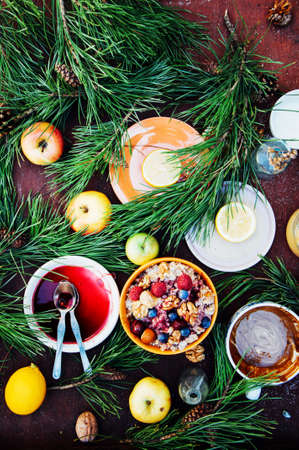 Healthy home made oatmeal porridge muesli with kefir yogurt and topped with blackberries, cherries and nuts.の写真素材