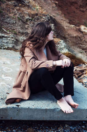 Fashion portrait of a girl on the sea. Portrait of girl on the sea background. Closeup sensual portrait of beautiful girl outdoors.の写真素材