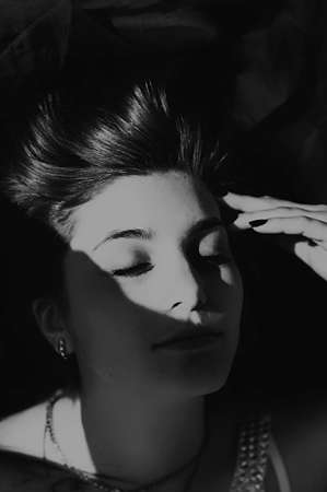 Portrait of a beautiful young girl outdoors. Outdoors portrait of beautiful young brunette woman looking at camera.の写真素材