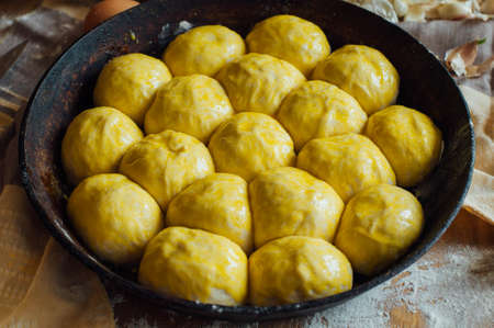 Preparing buns bread. Rustic style. Ingredients for homemade bread on wooden background.の写真素材
