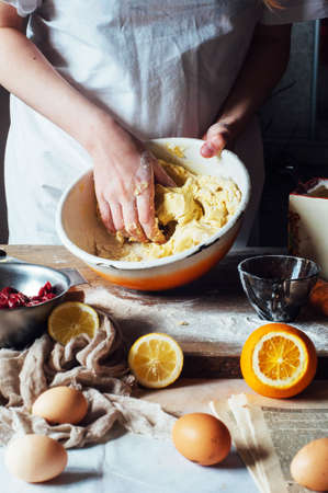 Steps of making cooking sandy cake with cherry filling : mixing ingredients: bowl, flour, eggs,  sour cream.の写真素材