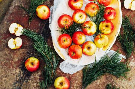 Apples sliced above rustic wooden table. Detox and healthy breakfast.の写真素材