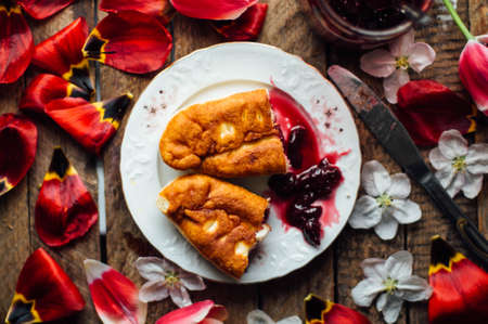 Home made cherry cakes with vanilla and icing sugar.の写真素材