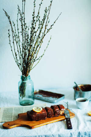 Cupcake for breakfast. Rustic dark styling. With retro filter effect. Homemade fresh-baked milk cake...