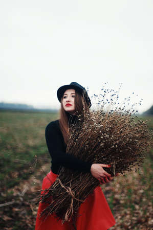 Beautiful young girl with long straight hair, light make-up in a stylish trendy in a black jacket...
