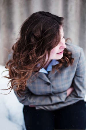 Young beautiful girl posing outdoors in the park. Portrait of a girl outdoorsの写真素材