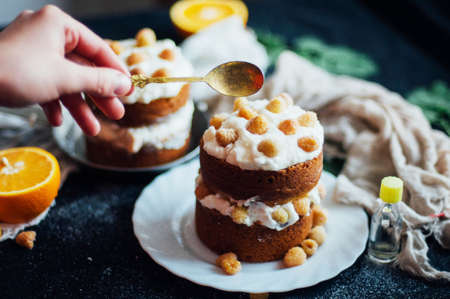 Raspberry Cupcake. Closeup of a cream cake covered with raspberries and gelatin. Raspberry Cake for holidays. Sponge cake with sour cream and raspberry. Cake with cream and berries. Contry kithen stylの写真素材