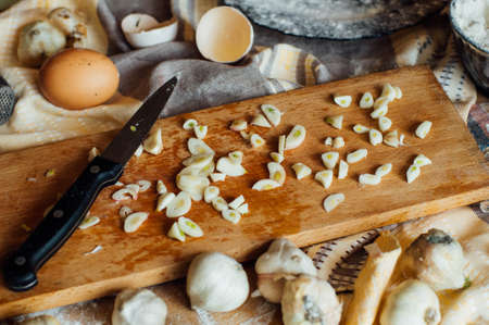 Preparing buns bread. Rustic style. Ingredients for homemade bread on wooden background. Bread cooking process.  kneading dough on wooden plate,bun cookingの写真素材